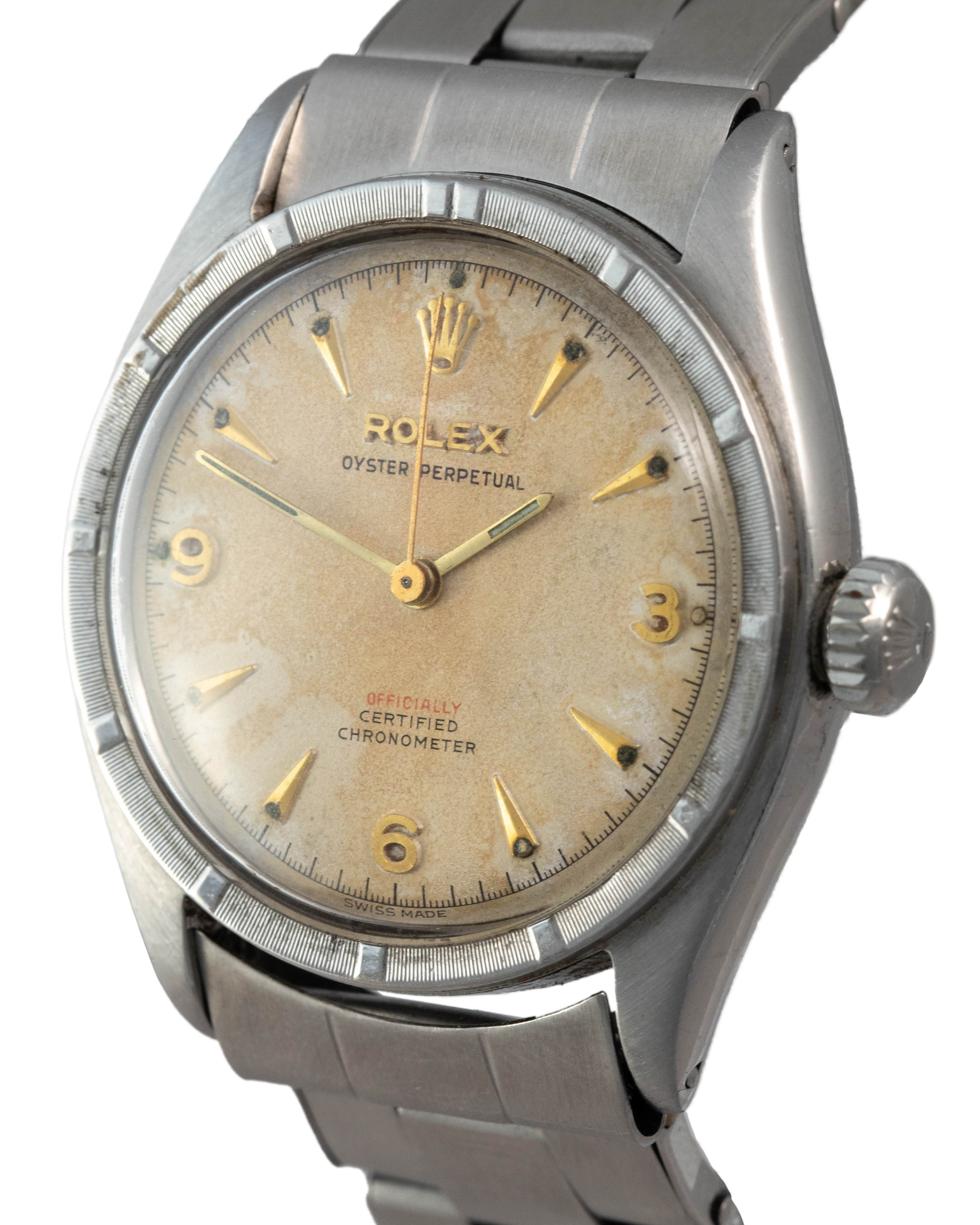 Rolex Ref. 6103 Oyster Perpetual in stainless steel with offically in red and gold indexes side view