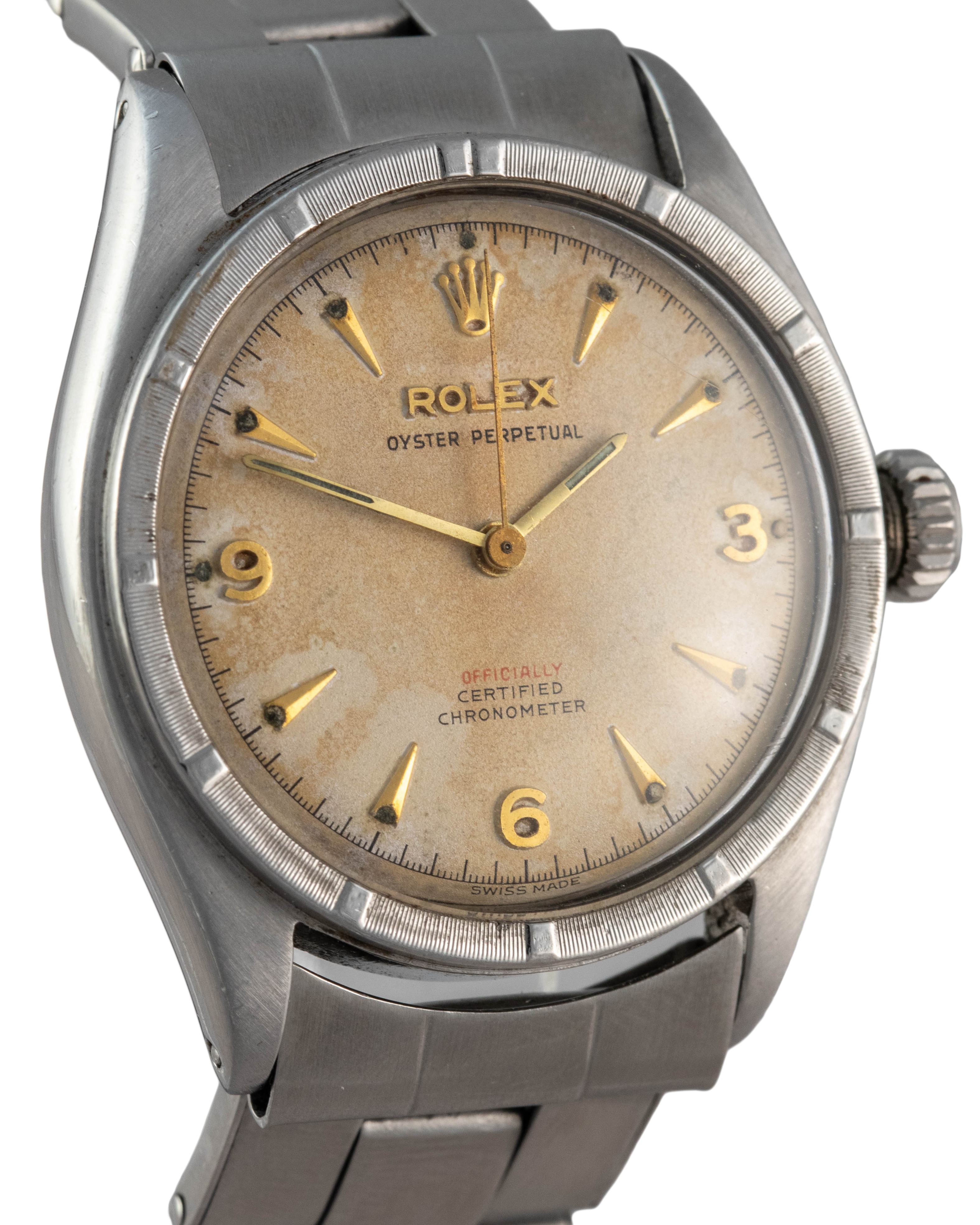 Rolex Ref. 6103 Oyster Perpetual in stainless steel with offically in red and gold indexes side view